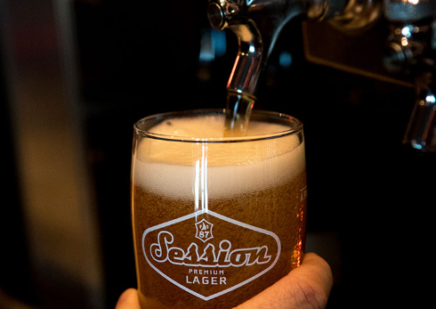 Beer poured from a tap